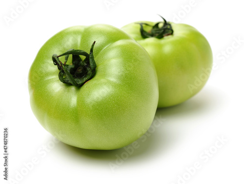 fresh green tomato isolated on white background