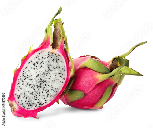 Delicious cut and whole dragon fruits (pitahaya) on white background