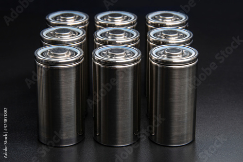 A consignment of new modern high-capacity lithium-ion cells. A prototype of new batteries on a black background