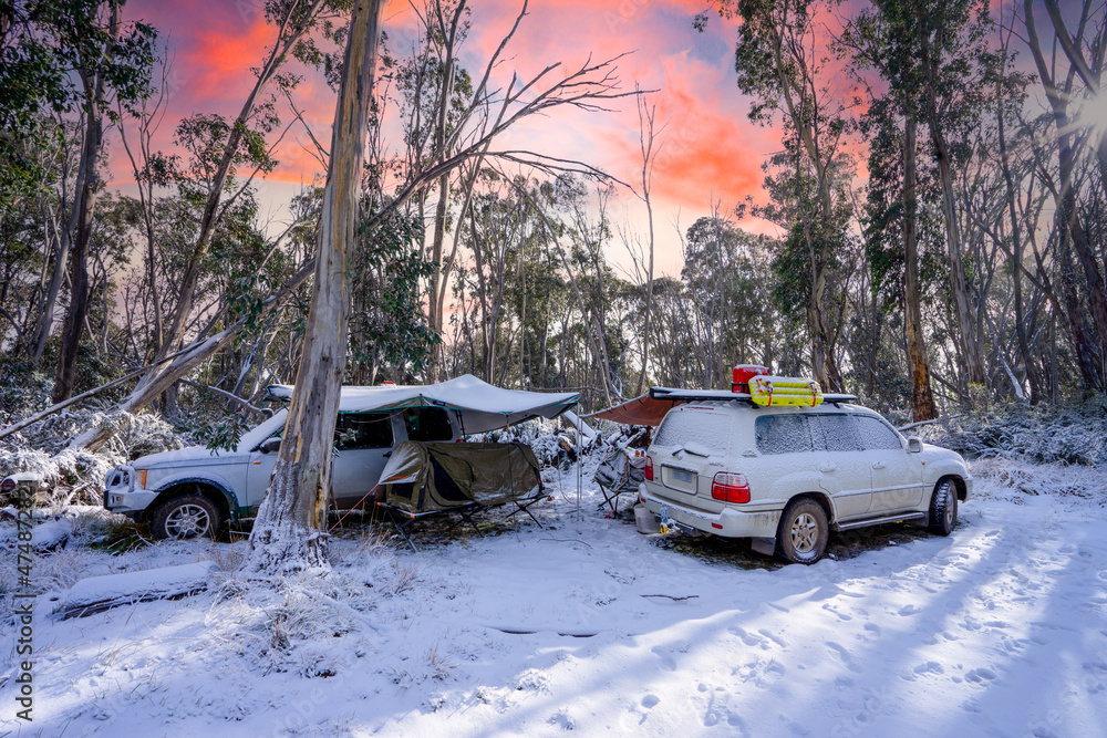 snow covered camp in swags in the high country