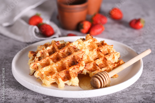 belgian waffles with honey are on the table