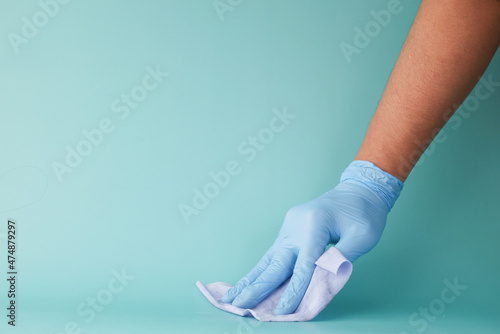 close up of person hand cleaning table with cloth 