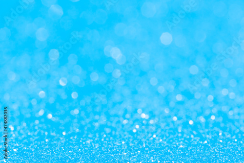 sparkles of Blue glitter abstract background. Copy space