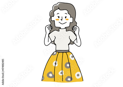 顔の横で拳を握るポーズをする女性　前向きなアクション
