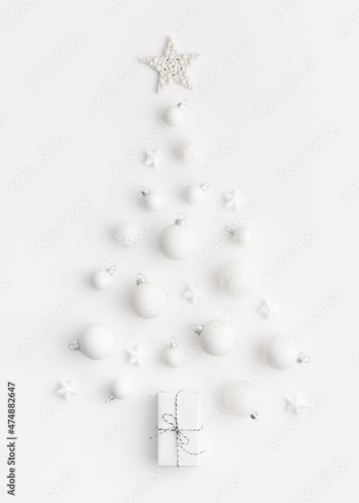 White Christmas balls in a shape of Christmas tree on white background. Banner. White Christmas balls in a shape of Christmas tree on white background. Banner.