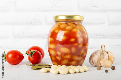 canned beans in tomato paste in a glass jar