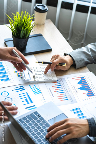 Foto Analyzing results, Businessman accountant or financial expert analyze business report graph and finance chart at the corporate office