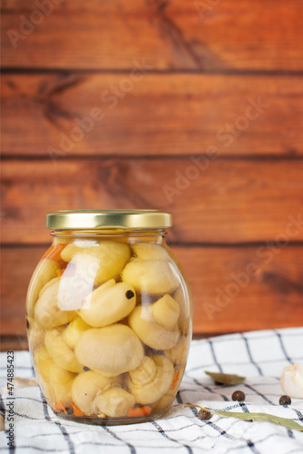 Marinated mushrooms in the glass jar