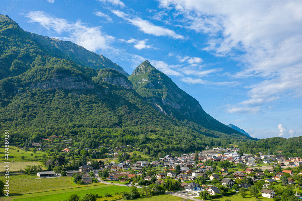 The town of Gresy sur Isere under its mountain in Europe, France, Isere, the Alps, in summer on a sunny day.