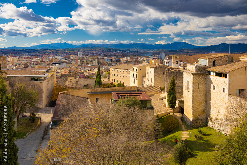 Panoramic aerial view of the city of Girona with the bell tower of the cathedral in the background. Catalonia, Spain