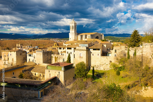 Panoramic aerial view of the city of Girona with the bell tower of the cathedral in the background. Catalonia, Spain