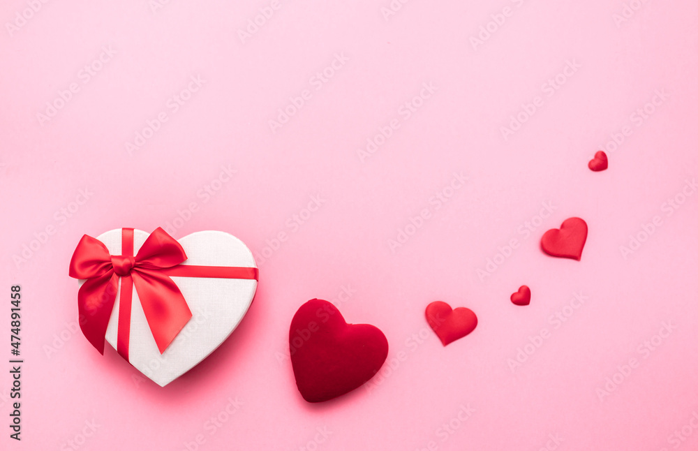 Love Valentine's Day. Love background. Gifts in the form of hearts on a pink background with the inscription love. Copy space for text. The concept of romance and love. square format. word