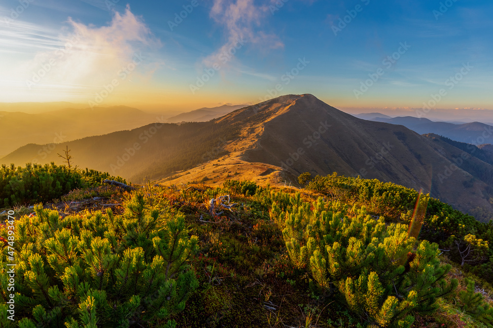 Magical sunset in the Carpathians overlooking Strimba peak, Gorgany region, Ukraine. Tourism and mountains concept.