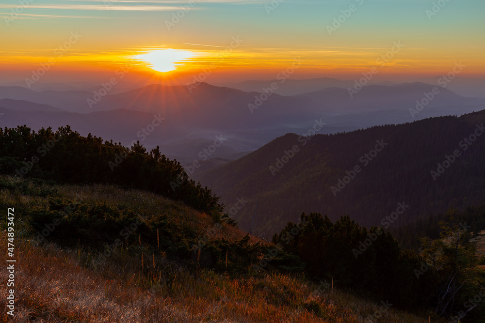 Obraz premium Sunset in the Carpathians, Gorgan region, Ukraine. Tourism and mountains concept. Magical sunset in the mountains.