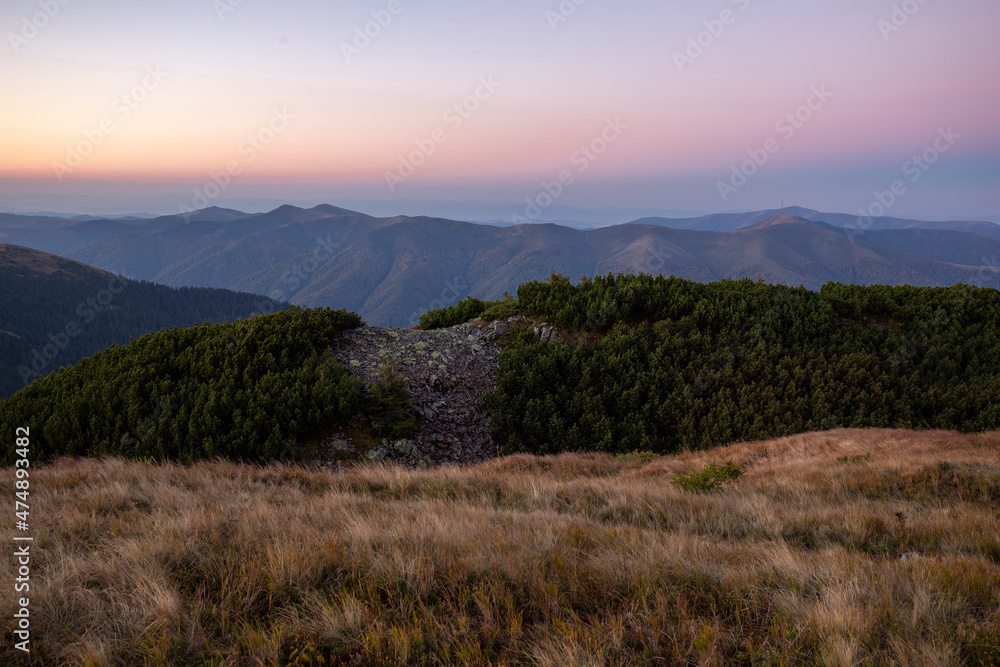 Magical sunset in the Carpathians overlooking the Krasna mountain range, Gorgany region, Ukraine. Tourism and mountains concept. Magical sunset in the Carpathians overlooking the Krasna mountain range, Gorgany region, Ukraine. Tourism and mountains concept.