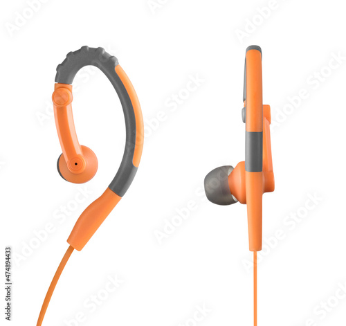 Front and side view of modern orange running earphones, isolated
 photo