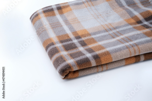 Blanket with a pattern isolated on gray.