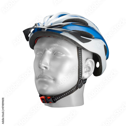 Modern black, blue and white bike helmet on a male mannequin head, isolated 