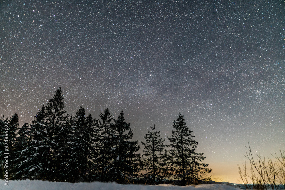 Starry sky in winter mountains