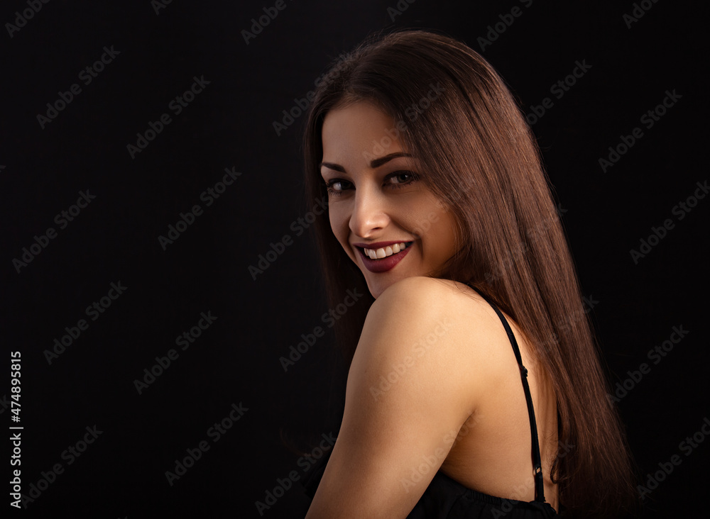 Beautiful makeup woman with long hair looking happy on black background. Closeup portrait Beautiful makeup woman with long hair looking happy on black background. Closeup portrait
