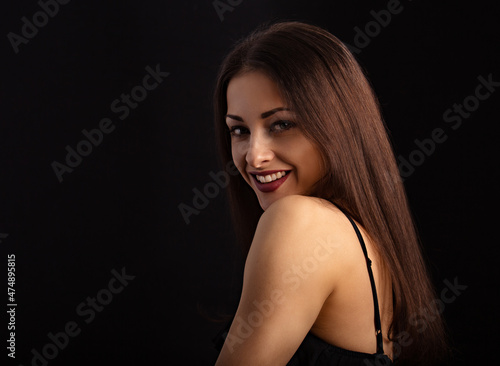 Wallpaper Mural Beautiful makeup woman with long hair looking happy on black background. Closeup portrait Torontodigital.ca