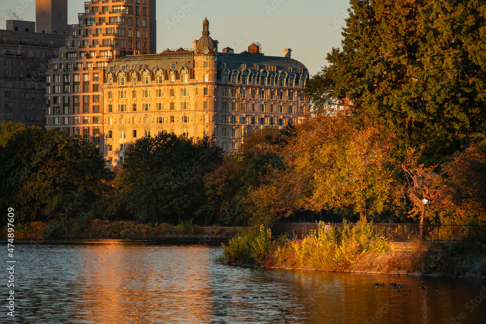 Upper West Side Sunrise and reflection on the Central Park Jacqueline Kennedy Onassis Reservoir. Autumn in Manhattan, New York City