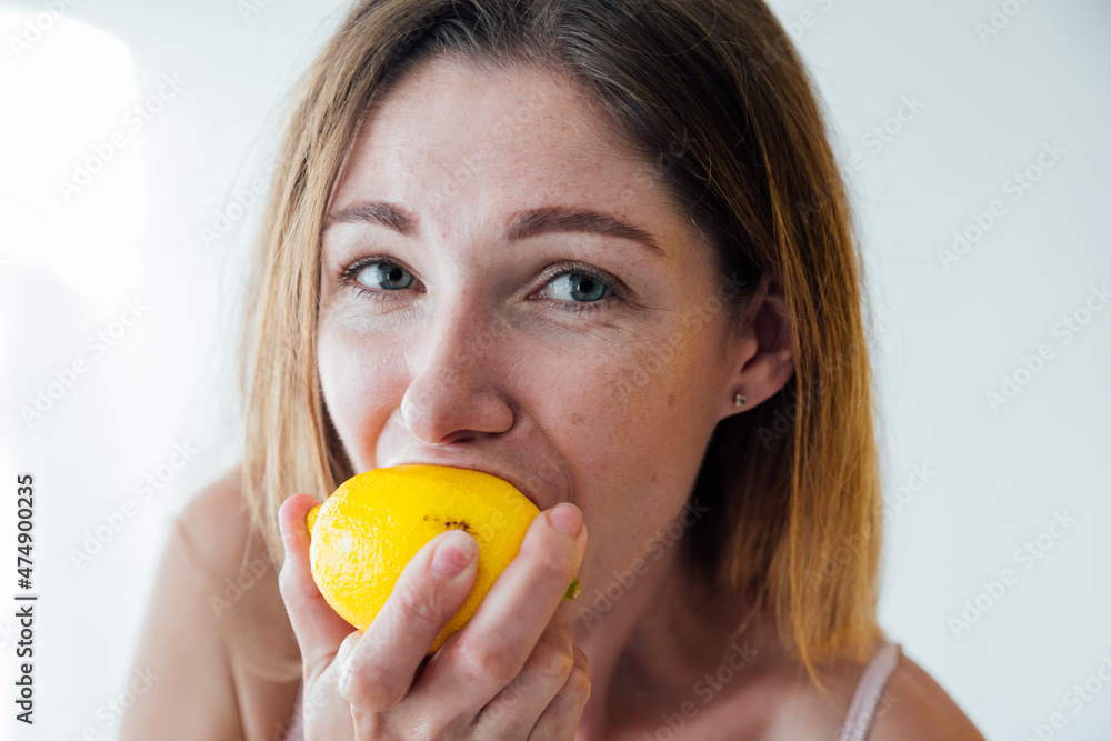 beautiful woman eating sour yellow lemon food beautiful woman eating sour yellow lemon food