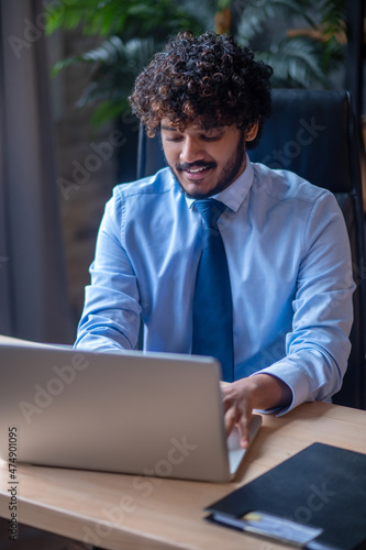 Man working on laptop in office