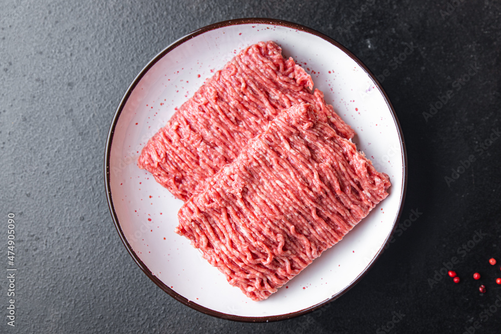 ground meat fresh minced meat pork, beef, lamb cutlets or meatballs healthy meal food diet snack on the table copy space food background rustic. top view ground meat fresh minced meat pork, beef, lamb cutlets or meatballs healthy meal food diet snack on the table copy space food background rustic. top view