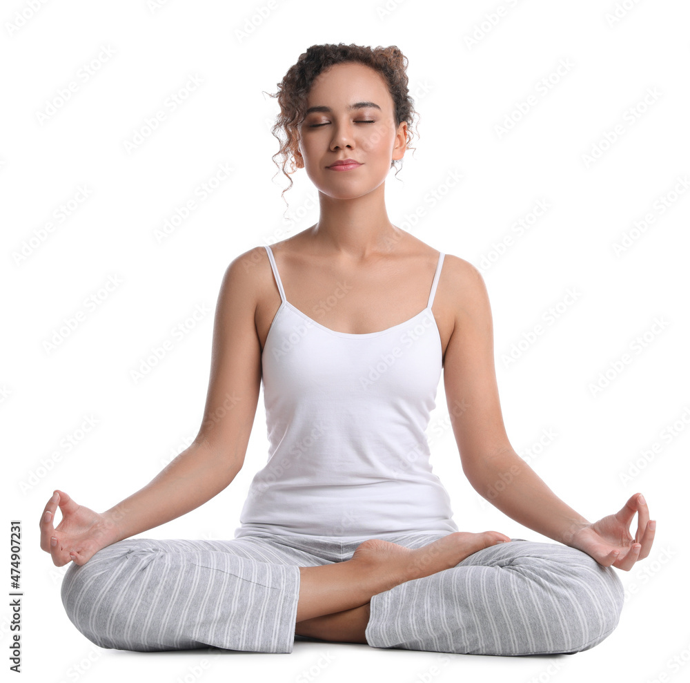 Beautiful African-American woman meditating on white background Beautiful African-American woman meditating on white background
