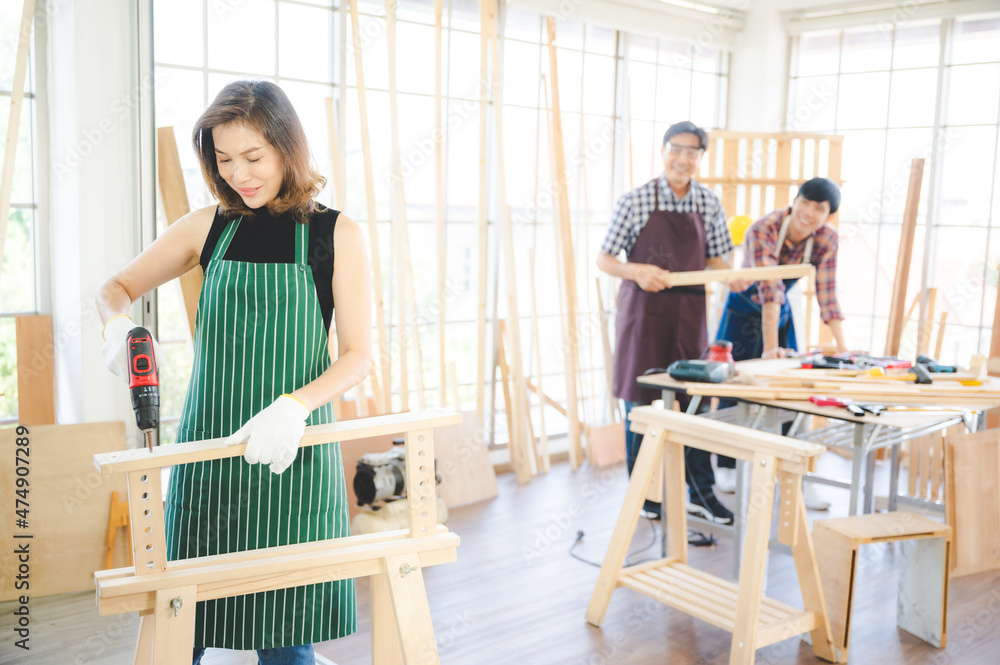 Obraz premium wooden workshop concept, carpenter team craftsman person working with a wood work construction tool