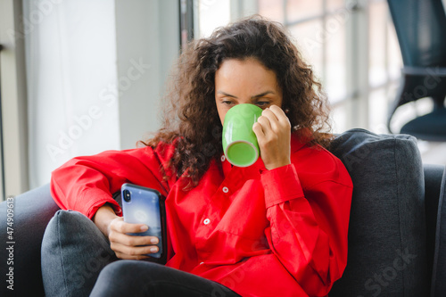 African American woman drin...