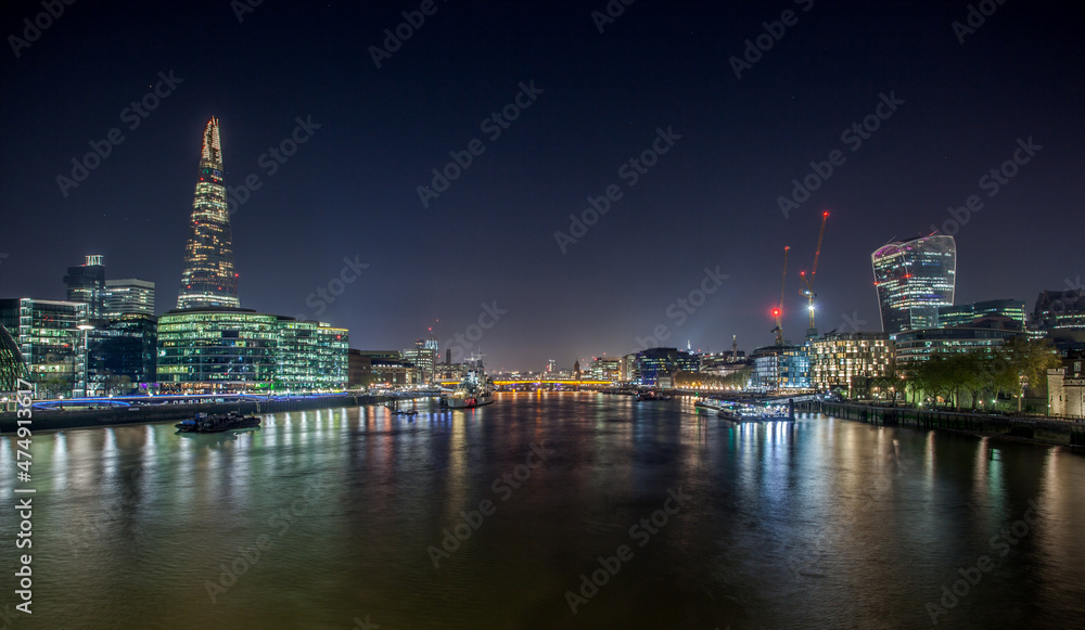 View from The Tower Bridge.The night view of Shard, a 95-storey skyscraper in Southwark, London.It is the glass clad pyramidal tower with 72 habitable floors.