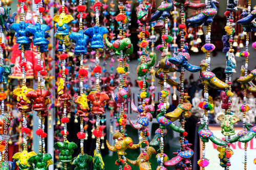 Pune, India, Handicraft items with selective focus, textile and wooden goods with traditional design for sale at Indian Market.