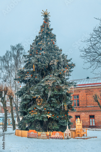 HDR photo in Limbazi center Decorated with a large spruce tree. Christmas tree with lights.