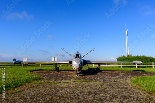 An airplane in front of the airfield of the traditional French village of Saint Sylvain in Europe, France, Normandy, towards Veules les Roses, in summer, on a sunny day.