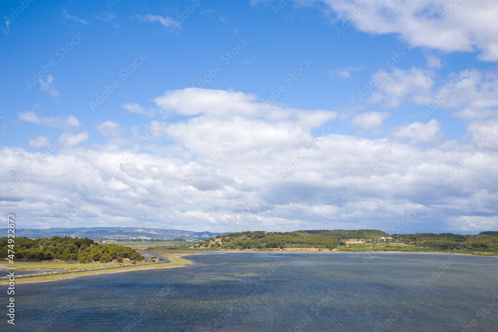 The town of Gruissan and its beautiful pond in Europe, France, Occitanie, Herault, in summer, on a sunny day.