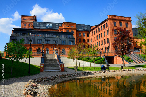 historic huge spinning mill factory built by Karl Wilhelm Scheibler, after revitalization it houses modern loft apartments, Ksiezy Mlyn, Tymienieckiego street, Lodz, Poland, Europe photo