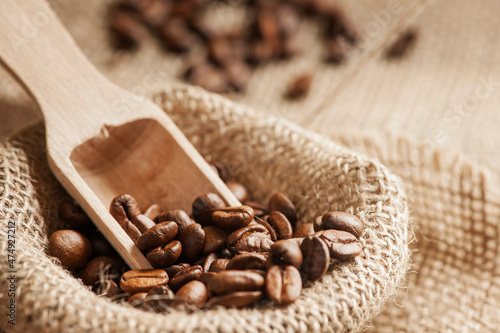 Roasted coffee beans on spoon