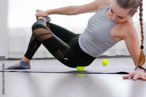 Woman use Myofascial release massage balls on hip