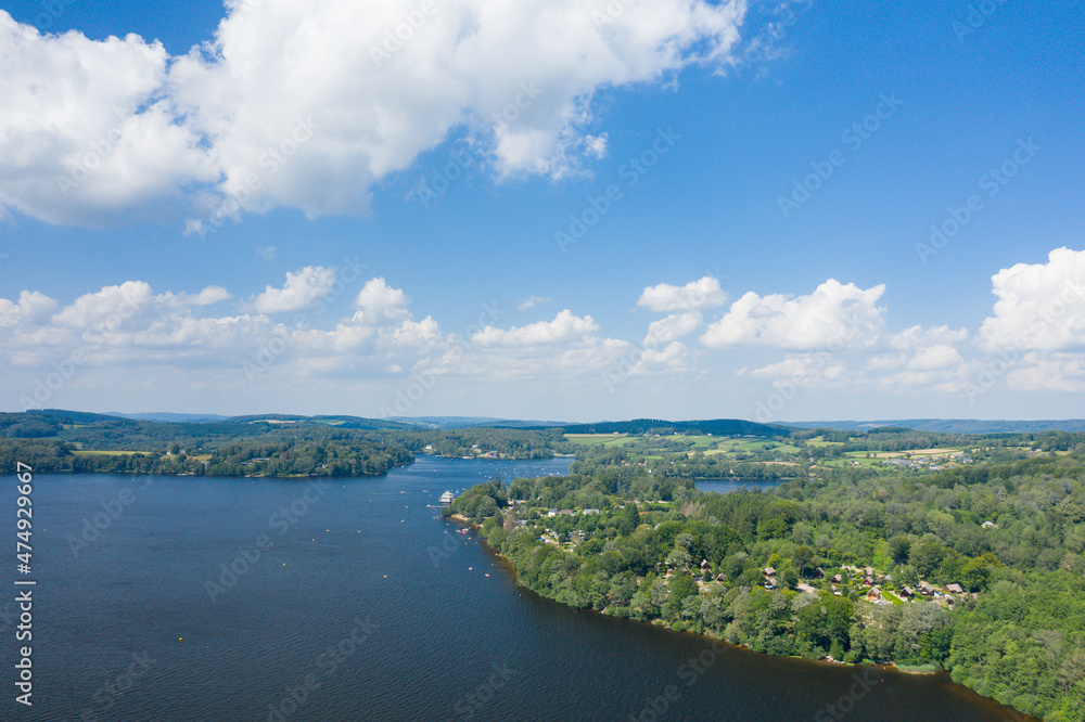 The Lac des Settons with its islands and its green banks in Europe, France, Burgundy, Nievre, Morvan, in summer, on a sunny day.