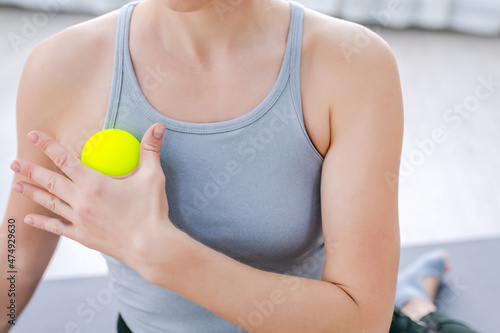 Close up Woman use Myofascial release massage balls on shoulder