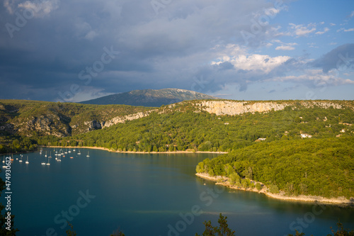 The edge of the lake of Sainte Croix and its forests towards Bauduen in Europe, in France, Provence Alpes Cote dAzur, in the Var, in the summer, on a sunny day.