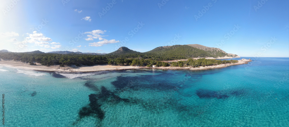 Panoramic photo of Cala Agulla beach in Mallorca. Beautiful view of the seacoast of Mallorca with an amazing turquoise sea, in the middle of the nature. Concept of summer, travel, relax and enjoy. Panoramic photo of Cala Agulla beach in Mallorca. Beautiful view of the seacoast of Mallorca with an amazing turquoise sea, in the middle of the nature. Concept of summer, travel, relax and enjoy.