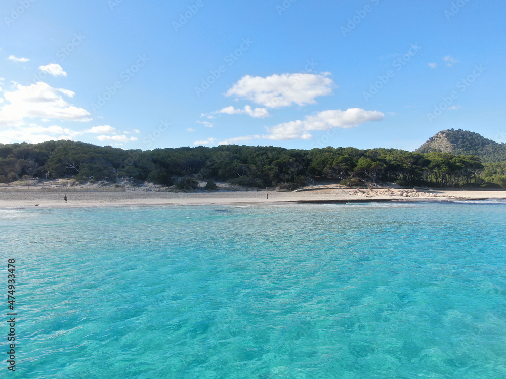 Cala Agulla Mallorca. Aerial view of the seacoast of the beach in Mallorca with torquoise water colour. Amazing photo of the beach. Concept of summer, travel, relax and holiday and vacation Cala Agulla Mallorca. Aerial view of the seacoast of the beach in Mallorca with torquoise water colour. Amazing photo of the beach. Concept of summer, travel, relax and holiday and vacation