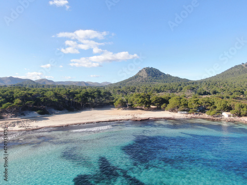 Cala Agulla Mallorca. Aerial view of the seacoast of the beach in Mallorca with torquoise water colour. Amazing photo of the beach. Concept of summer, travel, relax and holiday and vacation