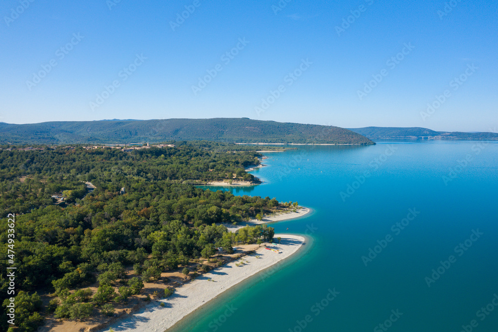 Forests and a beach at the edge of Lake Sainte-Croix in Europe, France, Provence Alpes Cote dAzur, Var, in summer, on a sunny day.