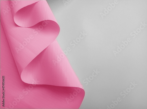 a sheet of plain pink flexion on a white background Fotobehang