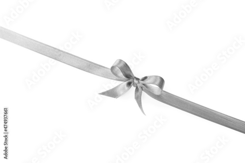Silver satin ribbon with bow on white background, top view