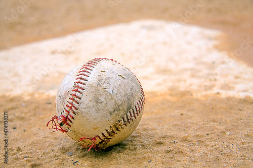 Close-up shot of a baseball on a baseball base.